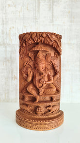 Intricate Cylindrical Wooden Carving with Ganesha and Sacred Cow Scenes